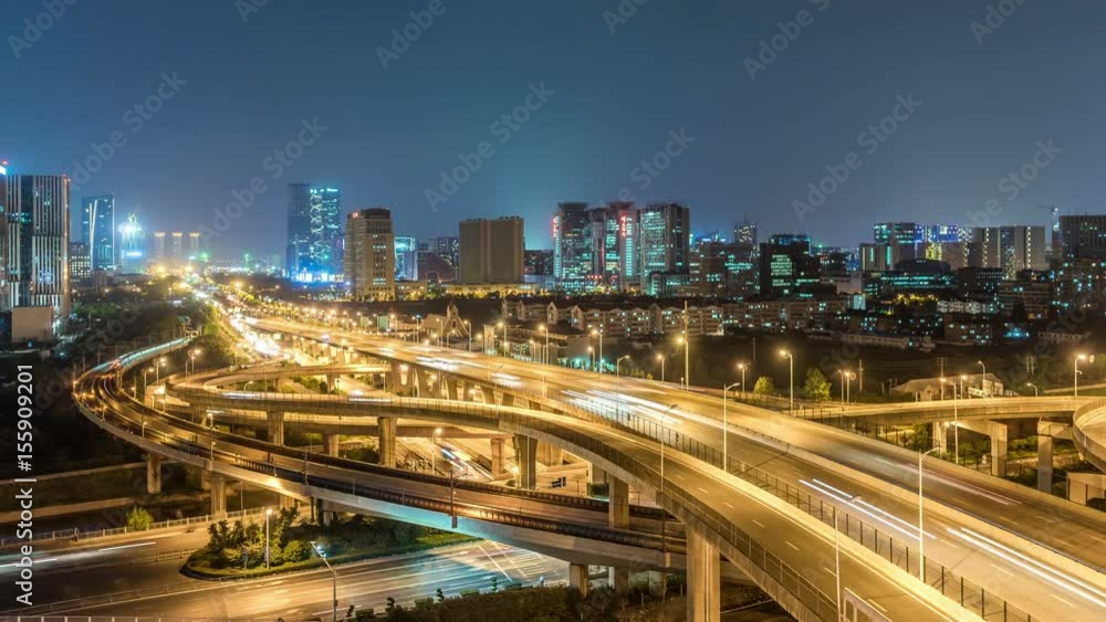 Time lapse of the busy interchange traffic at night in city Time lapse of the busy interchange traffic at night in city