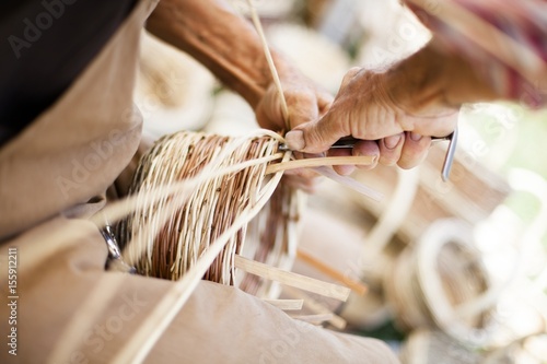 Artisan creates wicker baskets,  Italy