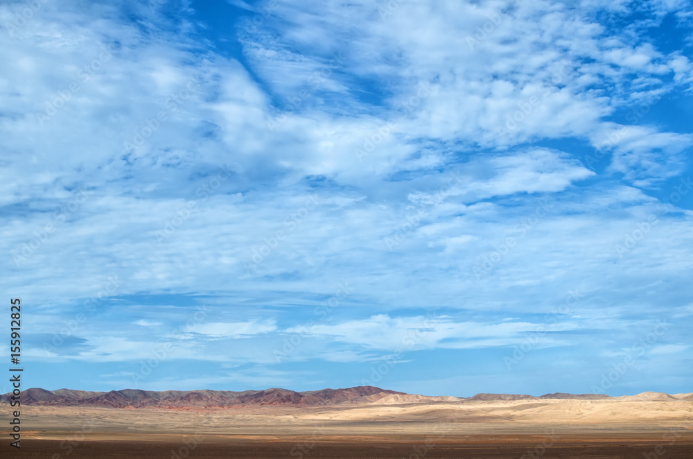 Desert under blue cloudy sky Desert under blue cloudy sky