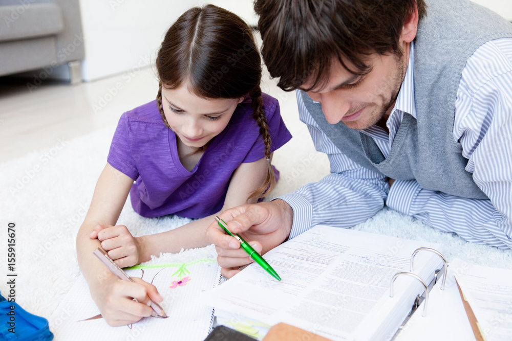 Father and girl doing paperwork close-up Father and girl doing paperwork close-up