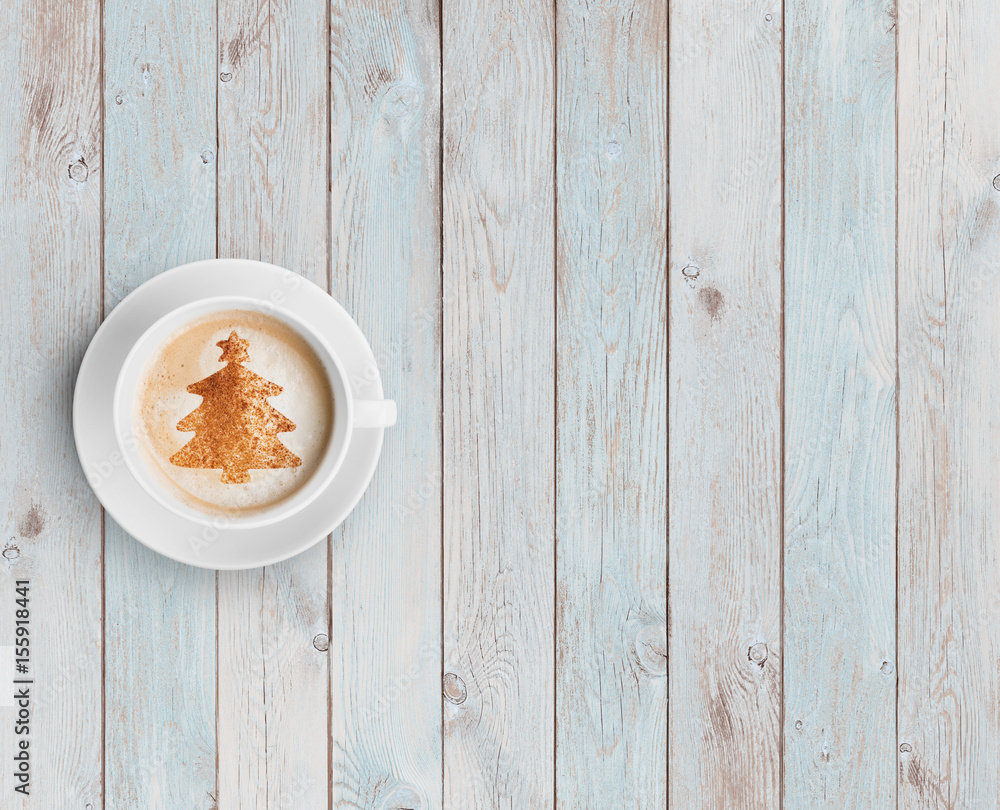 coffee mug with christmas tree on white wood table coffee mug with christmas tree on white wood table