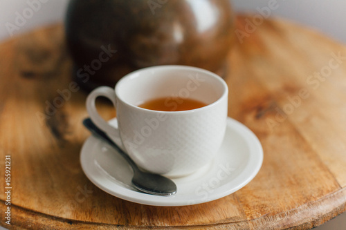cup of hot tea on a wooden table
