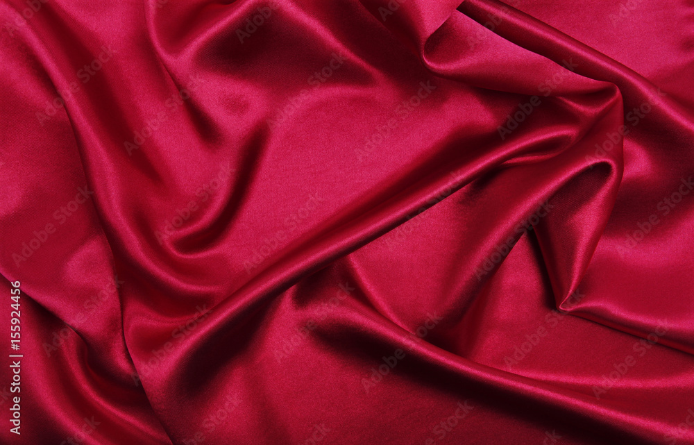 Smooth elegant red silk or satin luxury cloth texture as abstract background. Luxurious background design Smooth elegant red silk or satin luxury cloth texture as abstract background. Luxurious background design