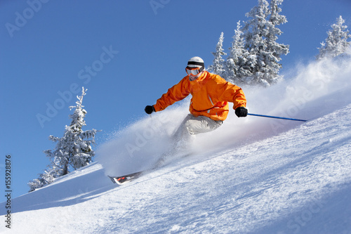 Man skiing down slope