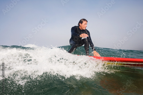 Man surfing a wave © Image Source RF