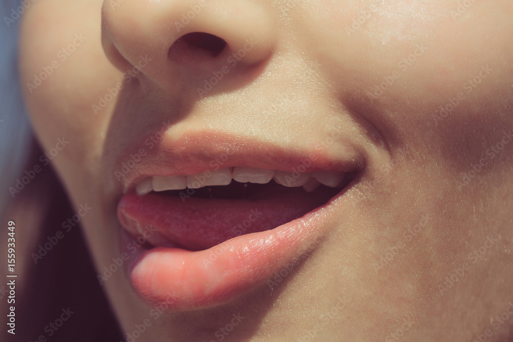 Naklejka premium tongue licking sexy, plump lips