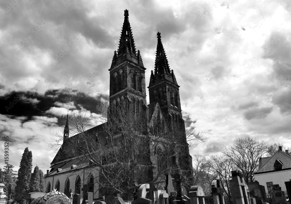 The Vyšehrad cathedral with its ancient cemetery in Prague in Czech Republic. Black and white.