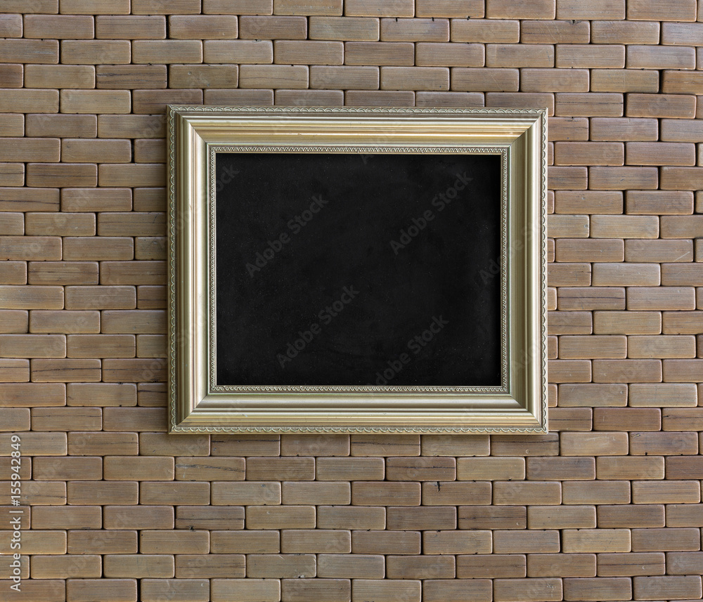 Gold frame.Background of wooden bricks.Old, rough, rough wooden wall and floor. Gold frame.Background of wooden bricks.Old, rough, rough wooden wall and floor.