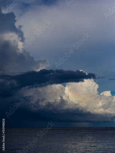 Rainbow clouds seascape. Beautiful colored sky. Unusual ocean weather. © yolya_ilyasova