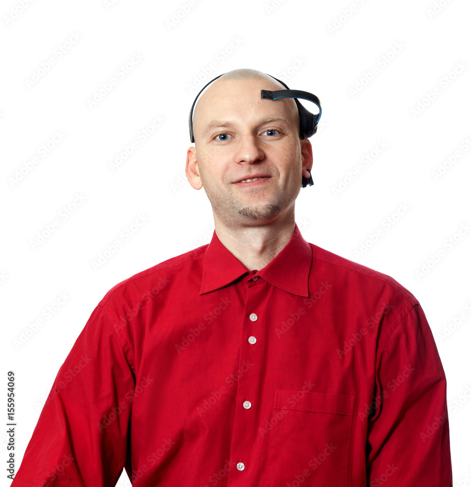 Portrait of young man in red shirt with EEG headset on head