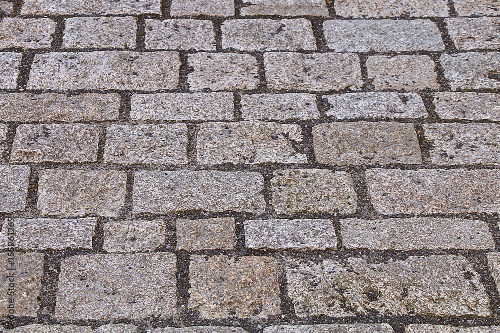 Fototapeta premium A street lined with stones and cobblestones