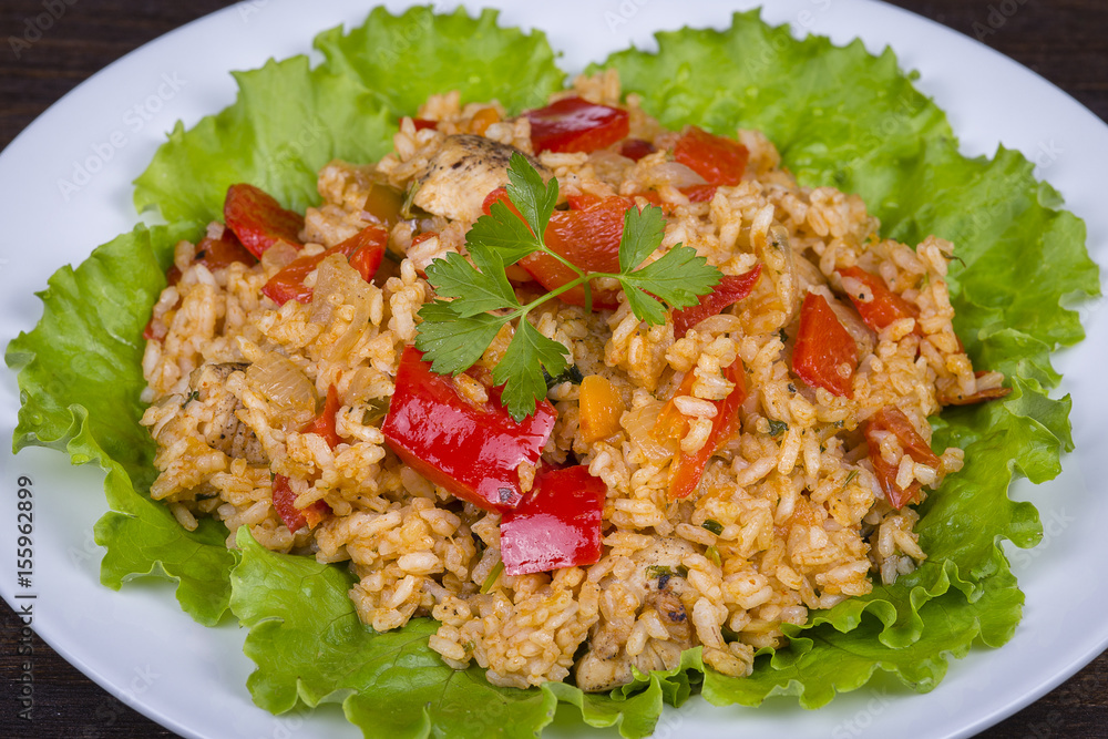 Rice with vegetables and chicken in a curry sauce. Rice with vegetables and chicken in a curry sauce.
