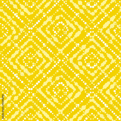 White and yellow paint dot setter concept summer seamless pattern.Modern dynamic abstract repeatable motif in summer sunny color. Vector illustration for surface design, fabric, 