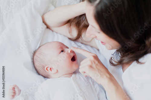 Baby looks at mother