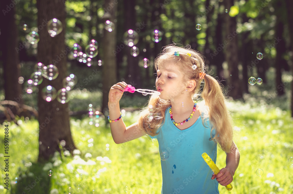having fun outdoor in the woods with bubbles