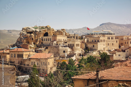 Urgup village landscape with old cave houses, Cappadocia © gilitukha