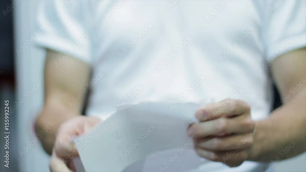 Calm Man tearing paper Calm Man tearing paper