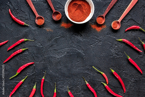 food ingredient red chilli pepper on dark table background top view mockup