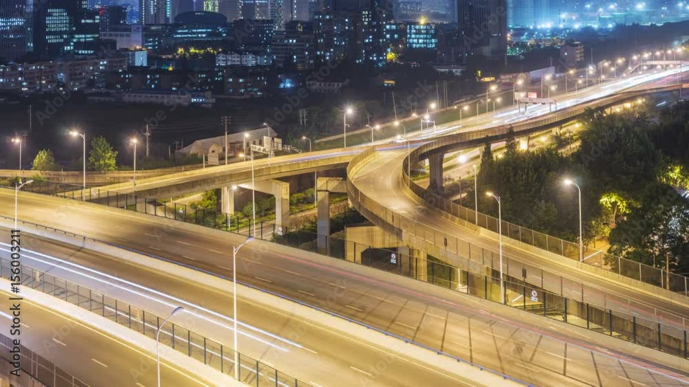 Time lapse of the busy interchange traffic at night in city Time lapse of the busy interchange traffic at night in city