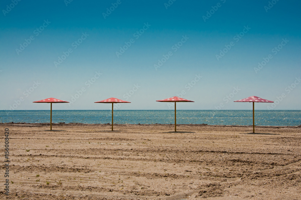 The parasols at the empty beach