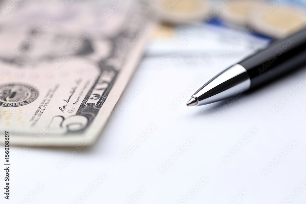 Payment cards, money and bills as payment concepts, banking, household bills. Shallow depth of field. Payment cards, money and bills as payment concepts, banking, household bills. Shallow depth of field.