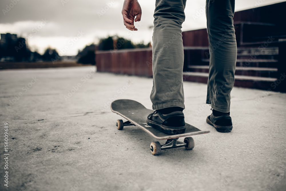 Man is going to skateboarding on the road, people, sport and skateboarding. concept of active recreation. Monochrome and high contrast. Man is going to skateboarding on the road, people, sport and skateboarding. concept of active recreation. Monochrome and high contrast.