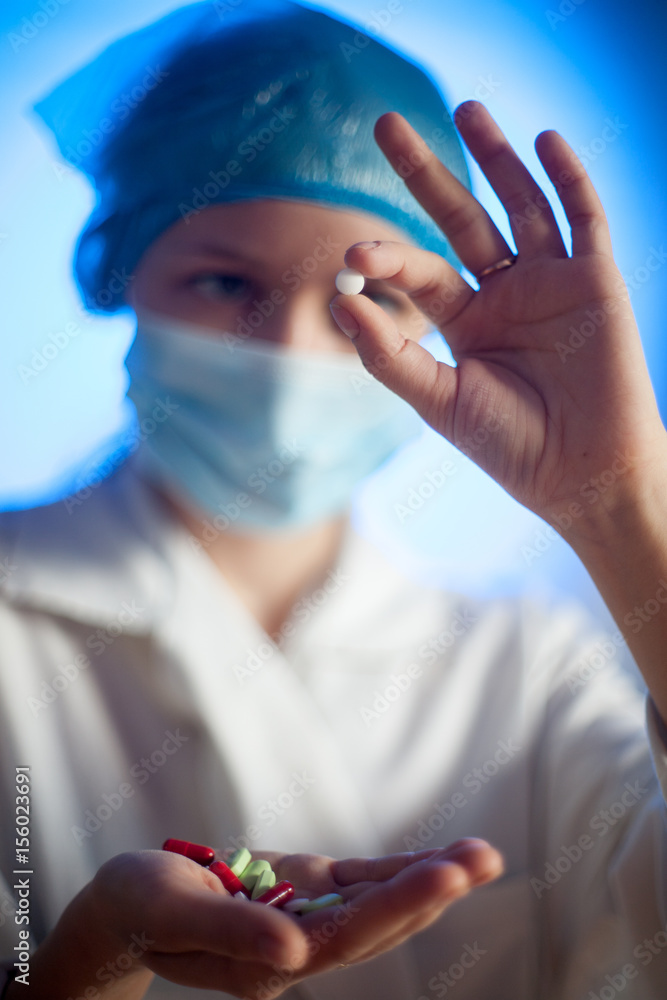 Nurse with pills in hand in hospital Nurse with pills in hand in hospital