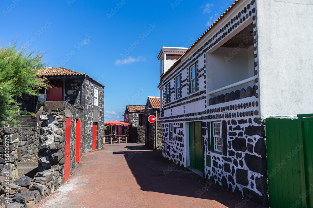PICO, AZORES - AUGUST 3, 2016:  The village of Lajido between vineyards, with houses built with lava stone, Pico, Azores, Portugal