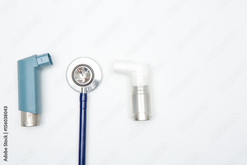 respiratory inhaler and stethoscope on white background respiratory inhaler and stethoscope on white background