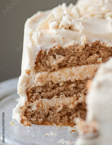 Wallpaper Mural close up of a piece missing from cinnamon roll layer cake with three layers and cinnamon swirl frosting Torontodigital.ca