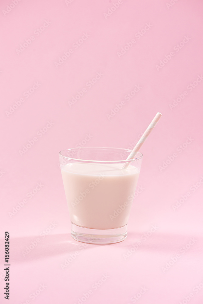Dairy products. A glass of milk on a pink background. Dairy products. A glass of milk on a pink background.
