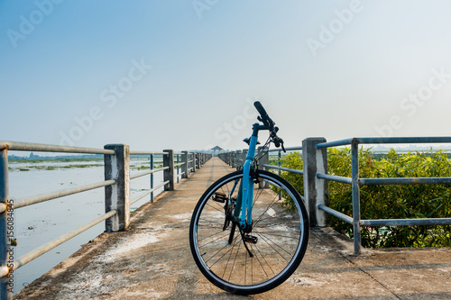 bicycle on Bridge view lake nonghan Sakon Nakhon Province, Thailand © sanpom