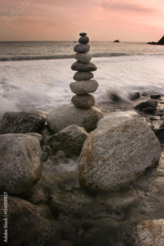 Piled rocks along seaside beach