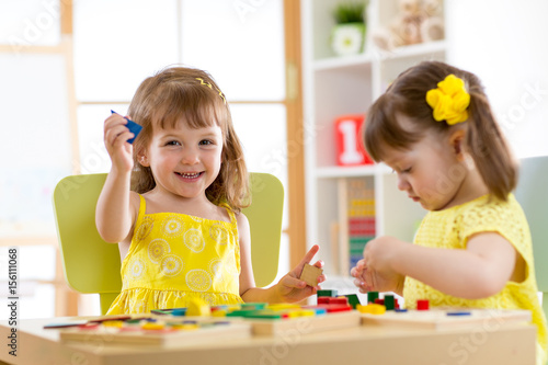 kids playing with developme...