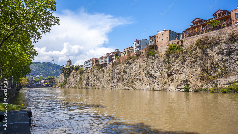 Metekhi church and Houses on the edge of a cliff above the river Kura. Tbilisi, the historic city center