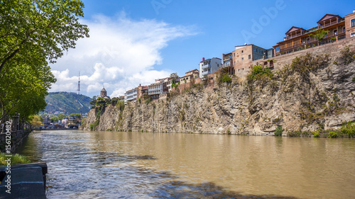 Metekhi church and Houses on the edge of a cliff above the river Kura. Tbilisi, the historic city center