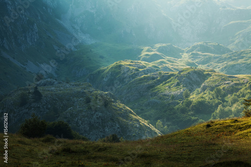 Sunbeam on cliff in mountain early in the morning.