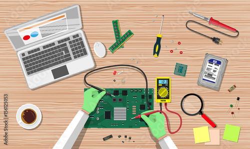 Engineer with multimeter check electronic board