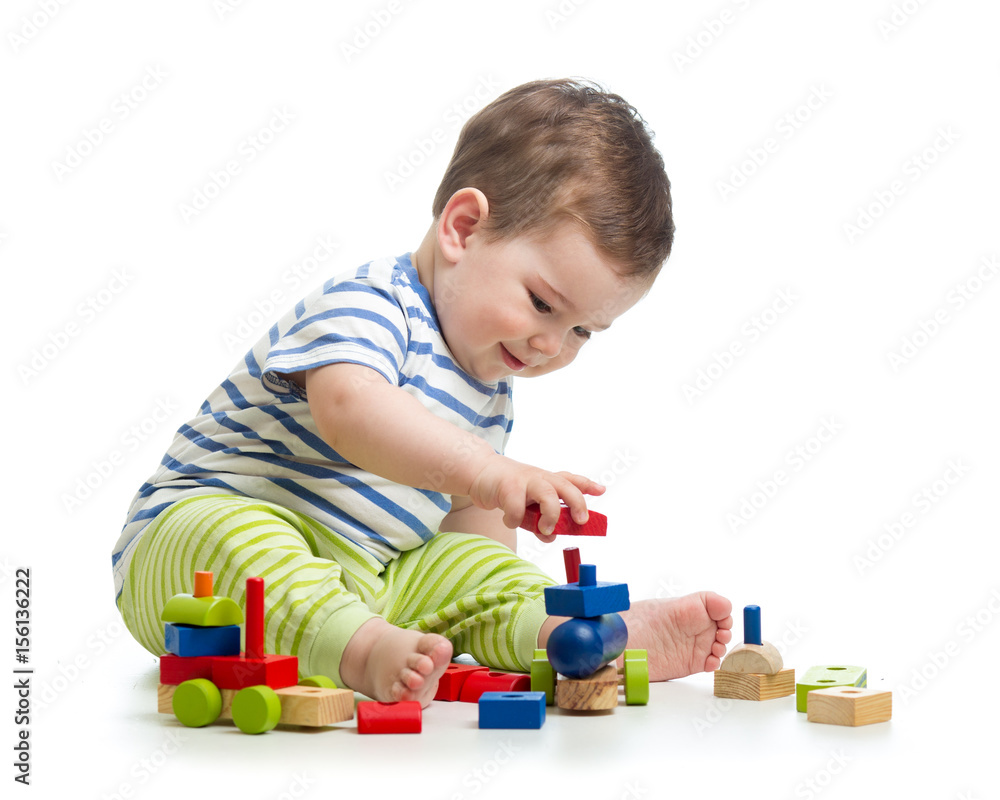 Baby boy playing with blocks toys. Isolated on white. Baby boy playing with blocks toys. Isolated on white.