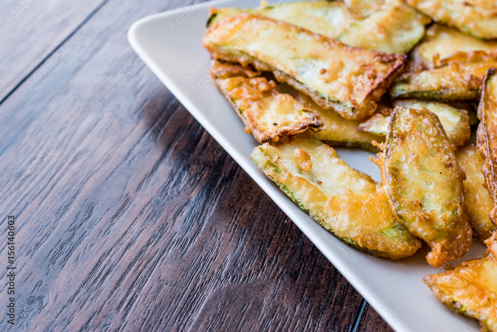 Homemade Fried Zucchini Fries on plate.