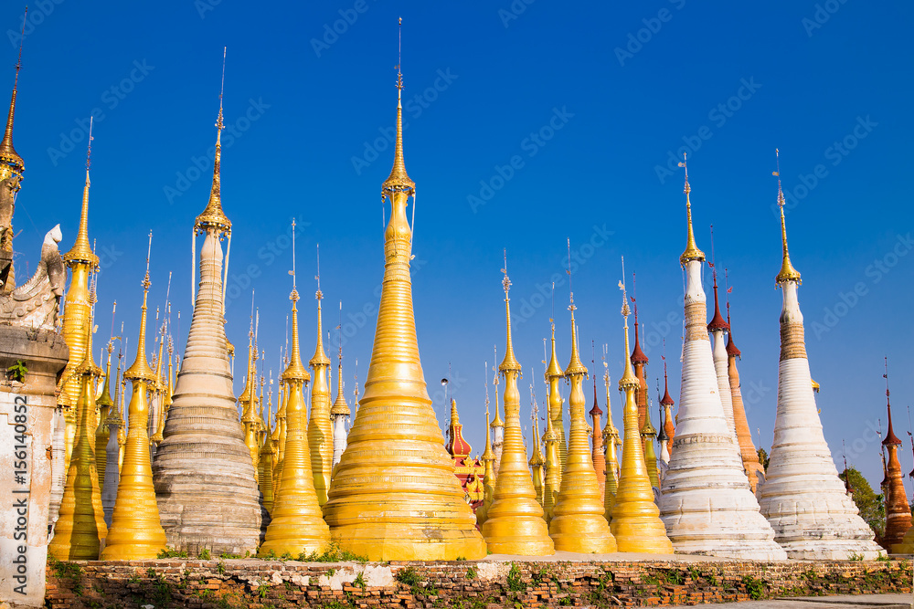 Fototapeta premium Scenic view of colorufl pagodas in Indein village Pagoda at Inle Lake, Myanmar