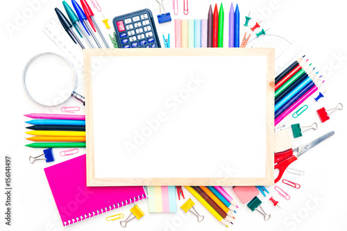  school supplies and blackboard with copy space on the table