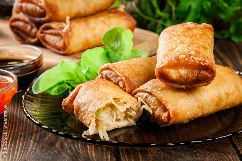 Spring rolls with chicken and vegetables served with sweet chili sauce or soy sauce Spring rolls with chicken and vegetables served with sweet chili sauce or soy sauce