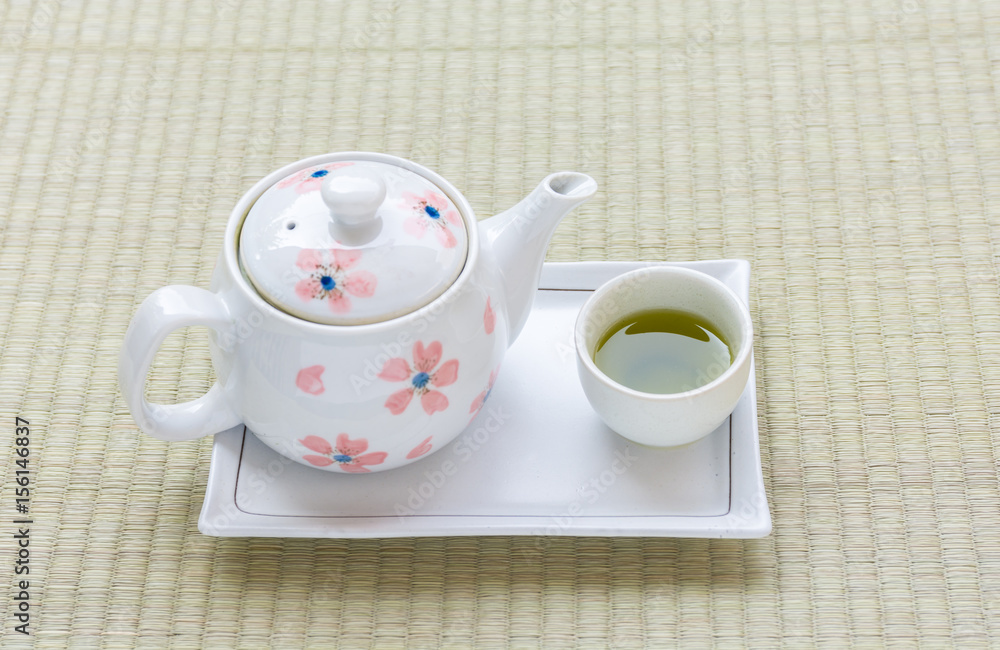 Tea pot with tea cup of matcha green tea. Tea pot with tea cup of matcha green tea.