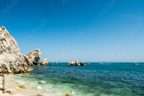 Fototapeta Naklejka Na Ścianę i Meble -  Mediterranean famous beach of Le Due Sorelle, Conero, Marche Italy