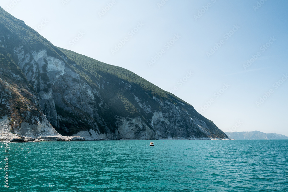 landscape Conero Mountain, the famous beach of Le Due Sorelle, Conero, Marche Italy seen from a boat
