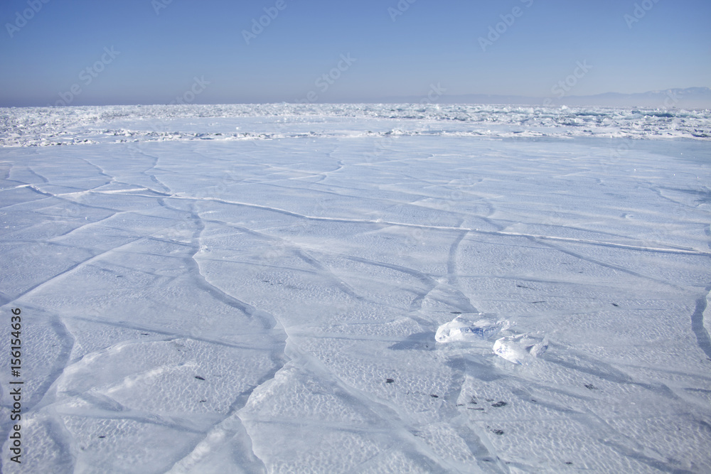 Lake Baikal, cracks in ice. Winter landscape