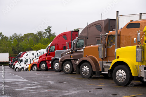 Wallpaper Mural Procession colorful trucks on the truck stop after the rain Torontodigital.ca