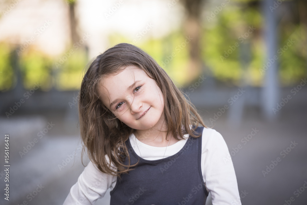Cute blonde girl posing outdoor on a beautiful spring day Cute blonde girl posing outdoor on a beautiful spring day