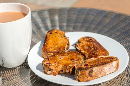 seeded toast and marmalade with cup of tea